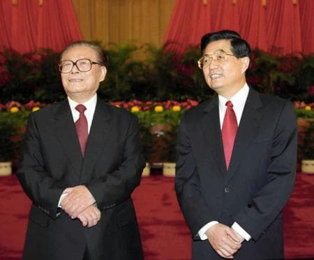 Jiang Zemin (left) and Hu Jintao (right) at the 16th National Congress of the Communist Party of China, Beijing, November 2002. The congress formally transferred the Party's General Secretaryship from Jiang to Hu, marking the first relatively orderly succession in PRC history.