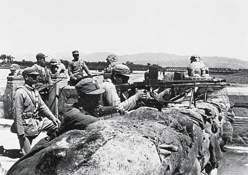 Soldiers of China's 29th Route Army at a machine-gun position on the Marco Polo Bridge, July 1937. The carved stone balustrades of the bridge are visible behind the troops. The 29th Army garrison defended the bridge and adjacent Wanping Fortress when Japanese artillery opened fire on 8 July 1937.